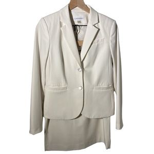 Calvin Klein skirt suit in Cream. Blazer size 4, skirt size 8.